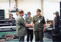 John shaking hands with a 2 star General